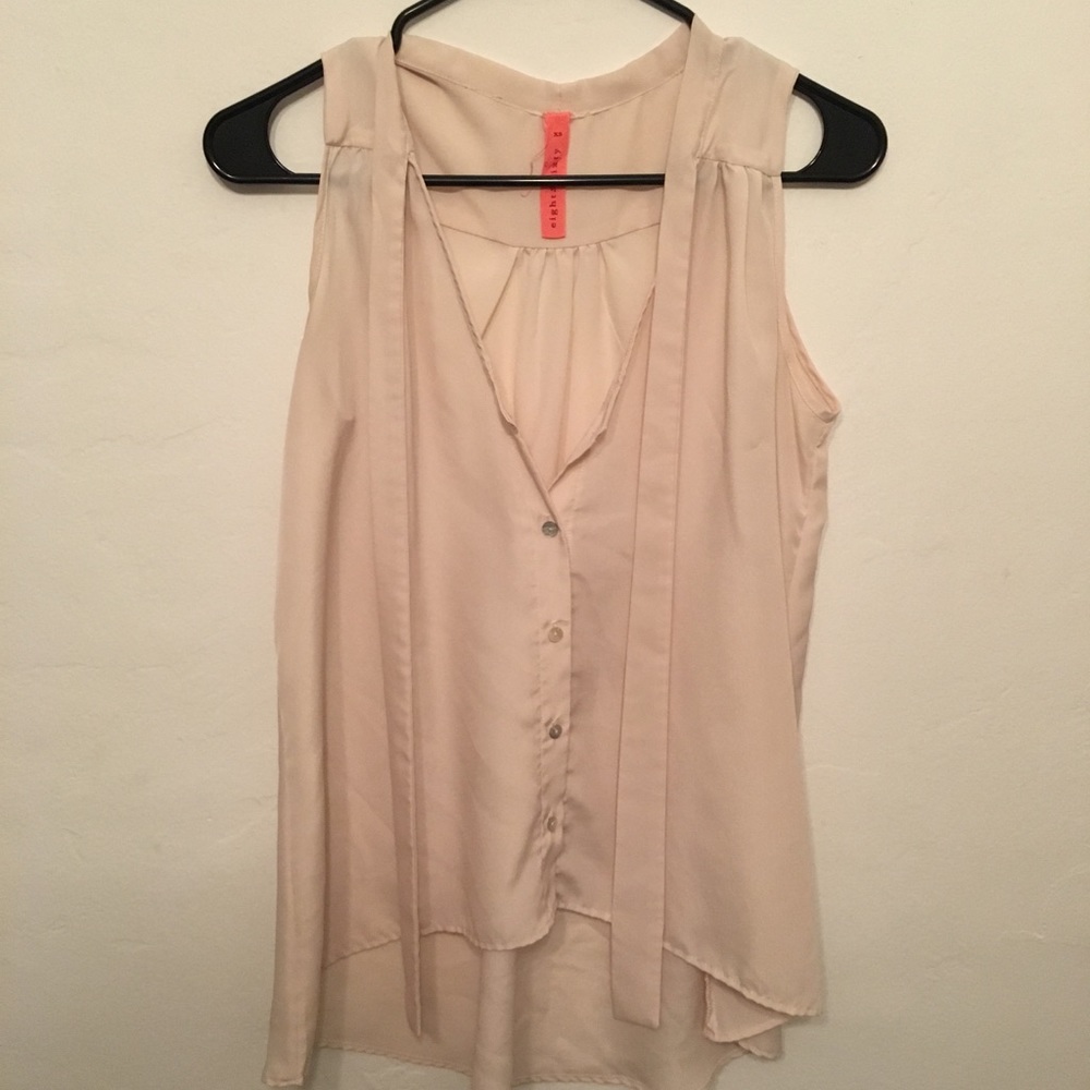 Cream sleeveless silky top with necktie